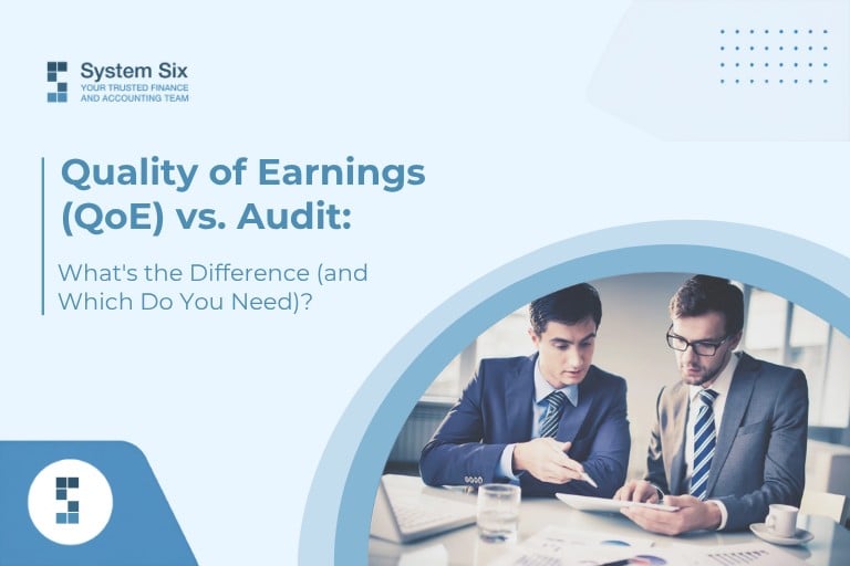 A featured image by System Six titled "Quality of Earnings (QoE) vs. Audit: What's the Difference (and Which Do You Need)?" showing two businessmen in suits reviewing financial documents and a tablet together in an office.