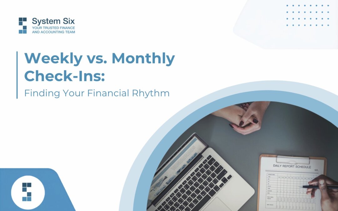 System Six blog cover titled “Weekly vs. Monthly Check-Ins: Finding Your Financial Rhythm,” featuring a workspace with a laptop, financial schedule, and notes.